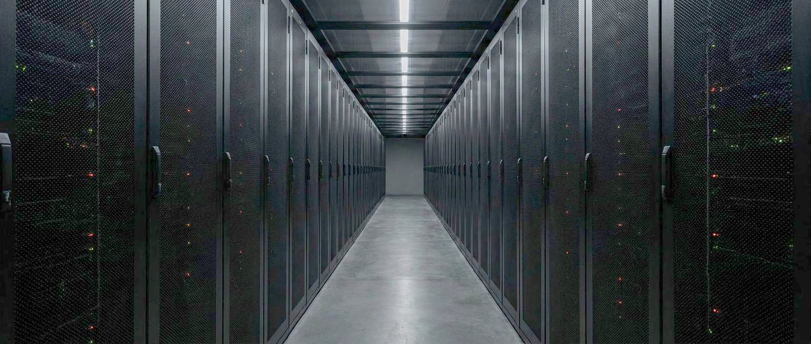 Cold aisle between server racks in a data centre